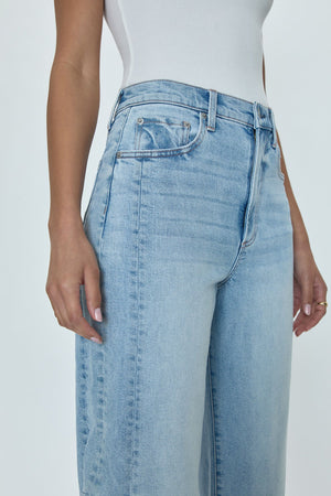 Ray of light. An arresting, modern silhouette achieved designed with a subtle bowed silhouette and a relaxed leg fit. Crafted from our wear-everywhere comfort stretch denim. Sun-kissed is a light blue, blasted denim wash with a contoured, slimming fade and whisker details.