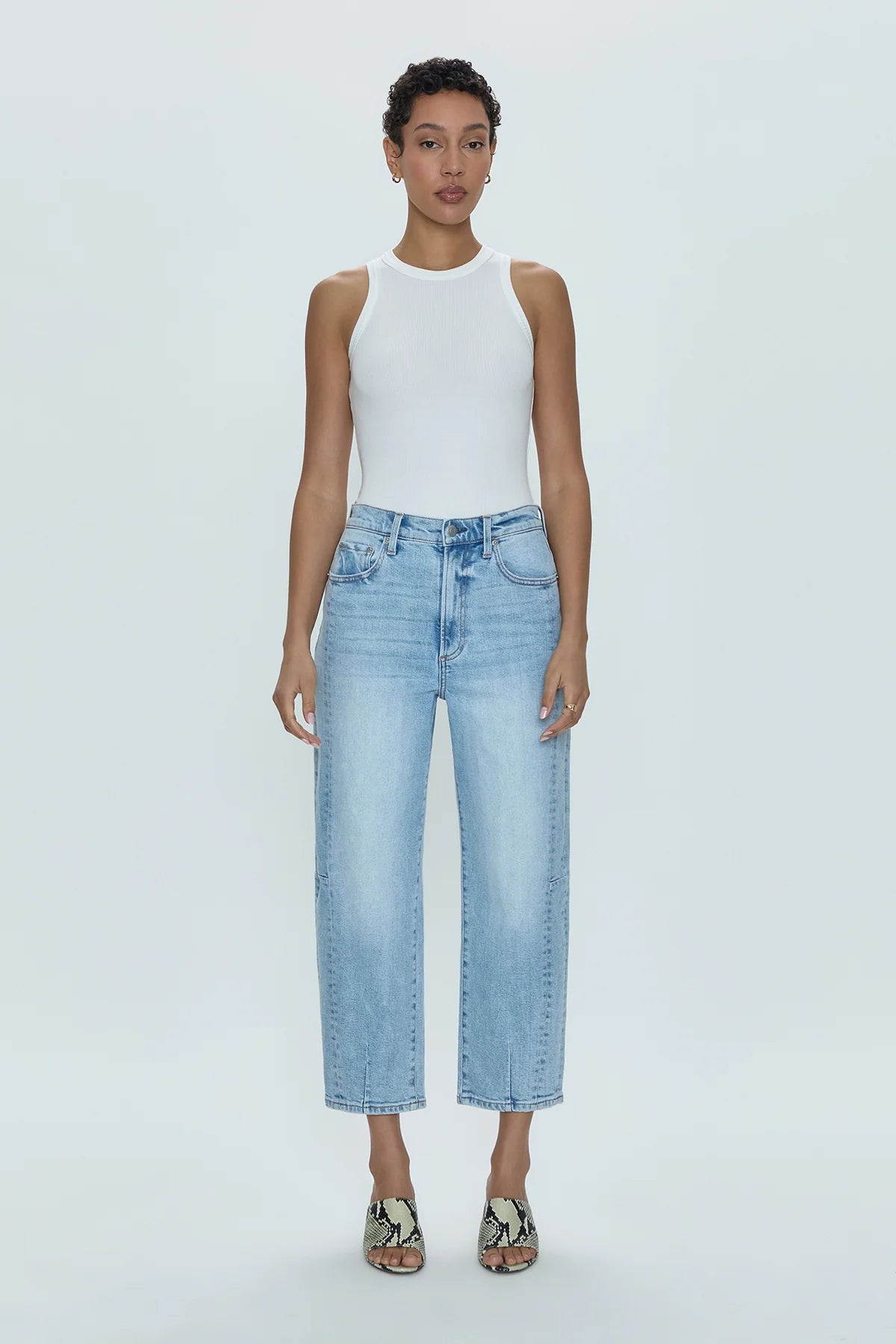 Ray of light. An arresting, modern silhouette achieved designed with a subtle bowed silhouette and a relaxed leg fit. Crafted from our wear-everywhere comfort stretch denim. Sun-kissed is a light blue, blasted denim wash with a contoured, slimming fade and whisker details.