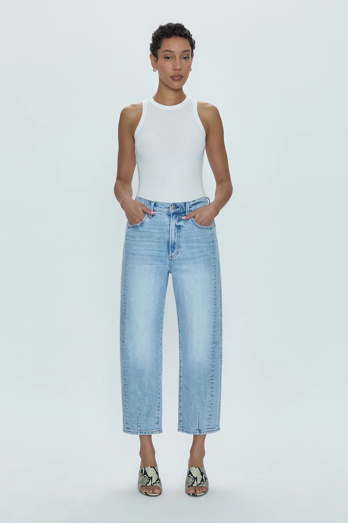Ray of light. An arresting, modern silhouette achieved designed with a subtle bowed silhouette and a relaxed leg fit. Crafted from our wear-everywhere comfort stretch denim. Sun-kissed is a light blue, blasted denim wash with a contoured, slimming fade and whisker details.