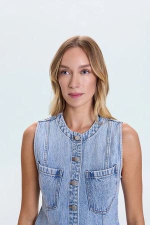 The GIA Vest is crafted from our premium rigid denim, engineered to maintain its striking shape and structure wear after wear. Thoughtful seaming details subtly elevate your look, complemented by sleek chest pockets and a modern split hem.