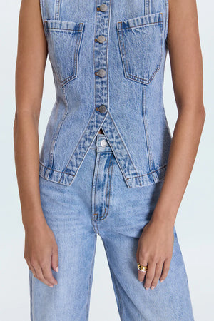 The GIA Vest is crafted from our premium rigid denim, engineered to maintain its striking shape and structure wear after wear. Thoughtful seaming details subtly elevate your look, complemented by sleek chest pockets and a modern split hem.