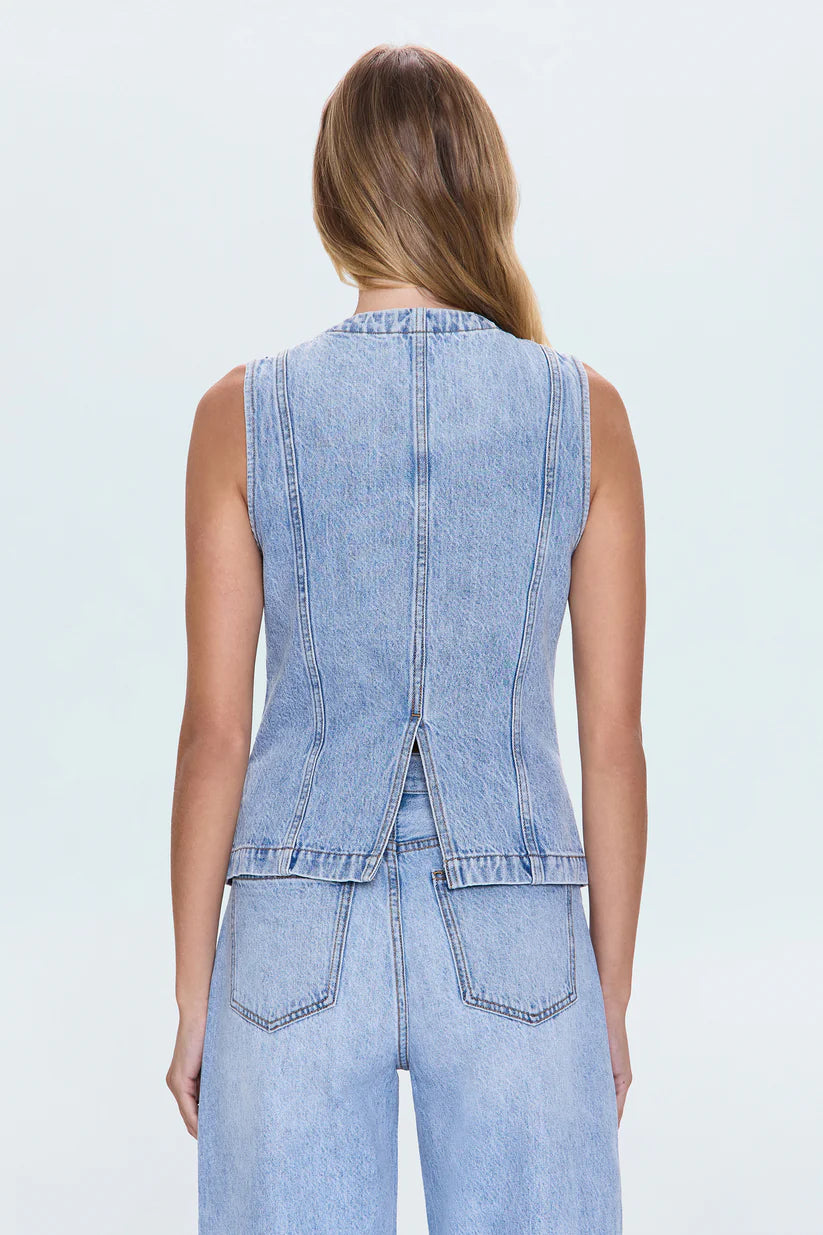 The GIA Vest is crafted from our premium rigid denim, engineered to maintain its striking shape and structure wear after wear. Thoughtful seaming details subtly elevate your look, complemented by sleek chest pockets and a modern split hem.
