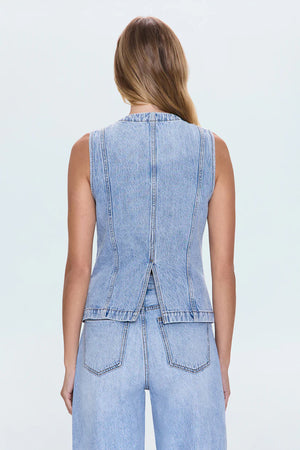 The GIA Vest is crafted from our premium rigid denim, engineered to maintain its striking shape and structure wear after wear. Thoughtful seaming details subtly elevate your look, complemented by sleek chest pockets and a modern split hem.