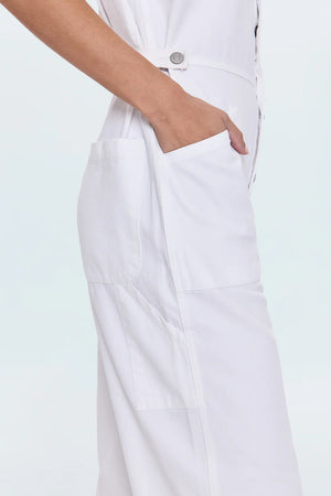 All-in-one outfitting, expertly realized in our best selling jumpsuit silhouette. Designed for a relaxed fit, with a button up bodice and waist for adjustable coverage and fit options. Vivid White is a pure white wash for a fresh, versatile look.&nbsp;