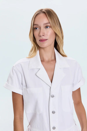 All-in-one outfitting, expertly realized in our best selling jumpsuit silhouette. Designed for a relaxed fit, with a button up bodice and waist for adjustable coverage and fit options. Vivid White is a pure white wash for a fresh, versatile look.&nbsp;