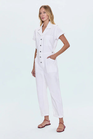 All-in-one outfitting, expertly realized in our best selling jumpsuit silhouette. Designed for a relaxed fit, with a button up bodice and waist for adjustable coverage and fit options. Vivid White is a pure white wash for a fresh, versatile look.&nbsp;