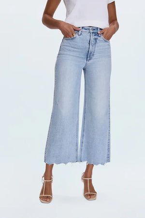 A relaxed, ultra wide leg silhouette featuring a raw finished hem and wide, stitched cuffs. Crafted from our signature comfort stretch denim to provide a structured shape with just the right give. Sun-Kissed Vintage is a light blue, blasted denim wash with a contoured, slimming fade and whisker details.