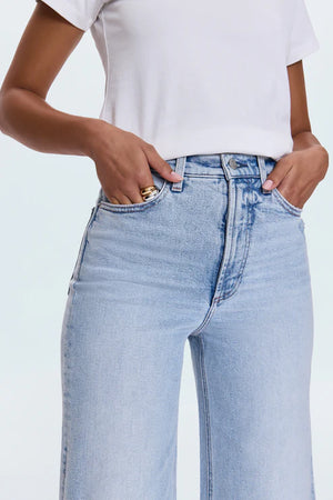 A relaxed, ultra wide leg silhouette featuring a raw finished hem and wide, stitched cuffs. Crafted from our signature comfort stretch denim to provide a structured shape with just the right give. Sun-Kissed Vintage is a light blue, blasted denim wash with a contoured, slimming fade and whisker details.