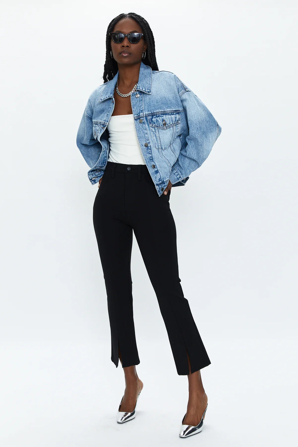 A chic pant you can everywhere, all the time. In a cropped boot cut fit, it hugs you from the hips to knee and flares out right above the calf for a proportional effect. Featured in a rich saturated black with center front slits at the hem, this pant is made in our super stretchy Ponte fabric that comfortably holds you in.