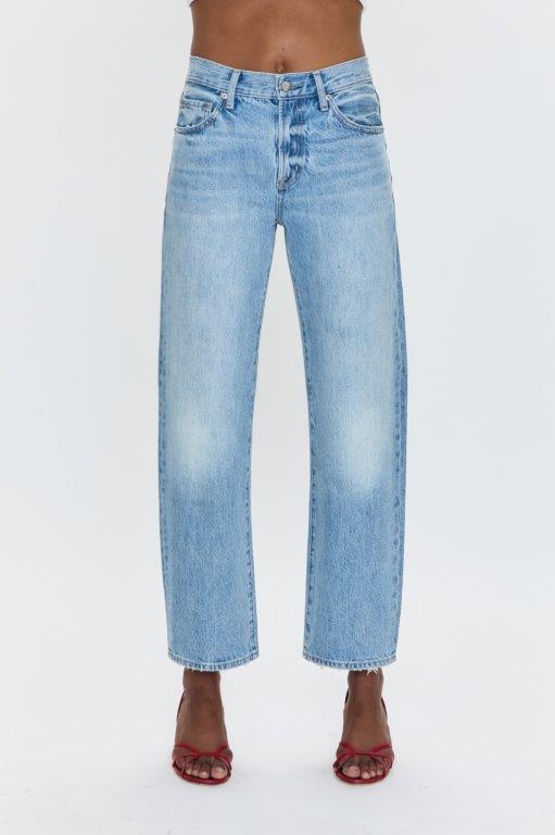 Mid-rise, with a straight leg that bows at the knees for an arched, barrel leg silhouette. Ankle length crop with a clean hem.