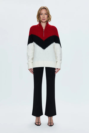 Medium weight pullover sweater with a relaxed pullover fit. With a quarter zip neckline and high sport collar. Lofty ribbing at cuffs and hem. Offered in a multi-colored red and black chevron motif over a cream white base hue.