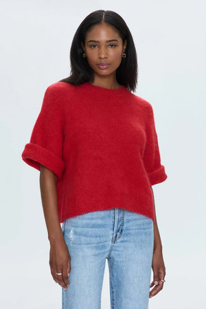 Medium weight wool knit blend with an ultra soft hand feel. Crafted into a relaxed, boxy tee silhouette with a crew neckline, dropped shoulders, and medium length half sleeves. Relaxed ribbing on sleeves, neckline, and hem. Offered in a rich, vibrant red hue.