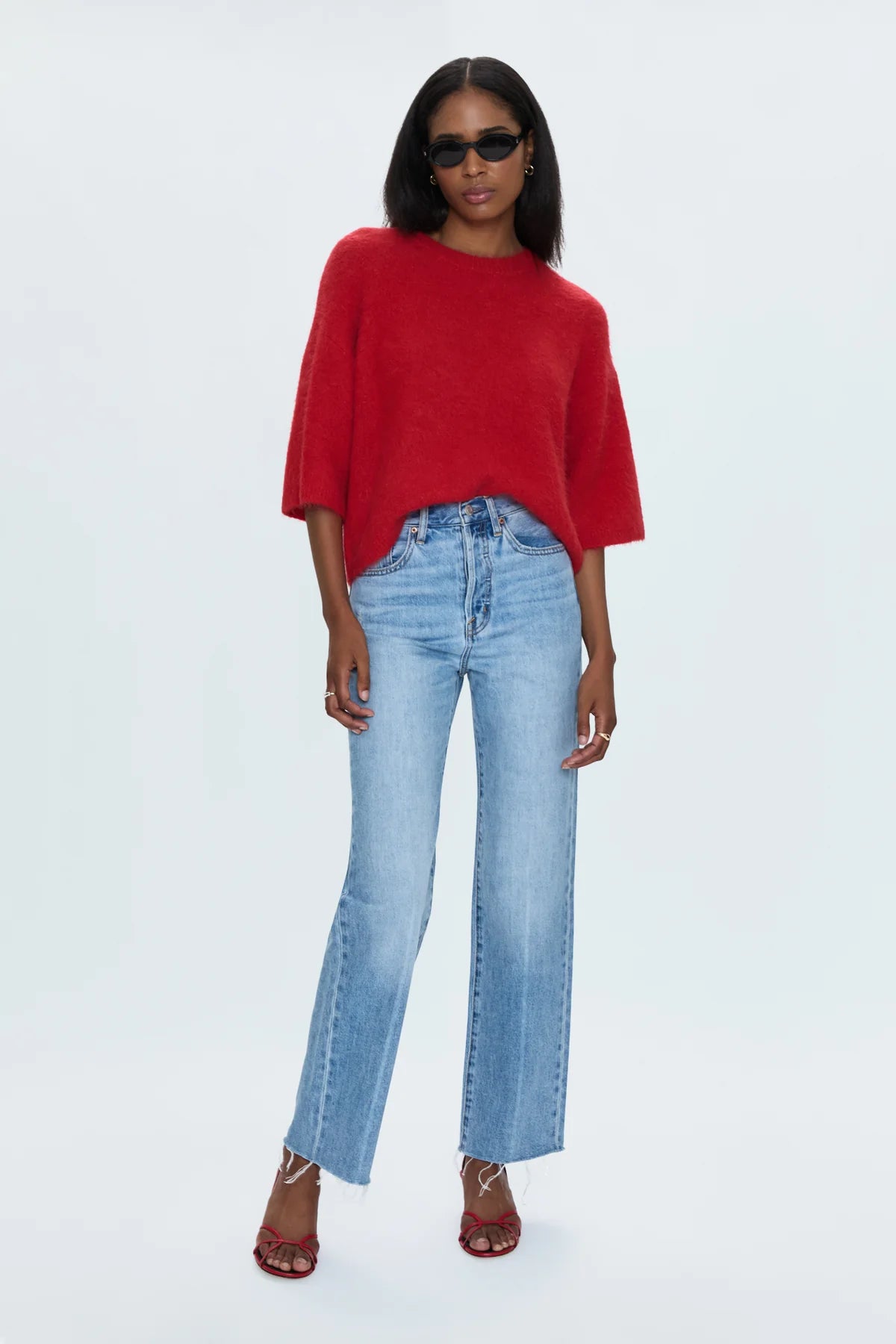 Medium weight wool knit blend with an ultra soft hand feel. Crafted into a relaxed, boxy tee silhouette with a crew neckline, dropped shoulders, and medium length half sleeves. Relaxed ribbing on sleeves, neckline, and hem. Offered in a rich, vibrant red hue.