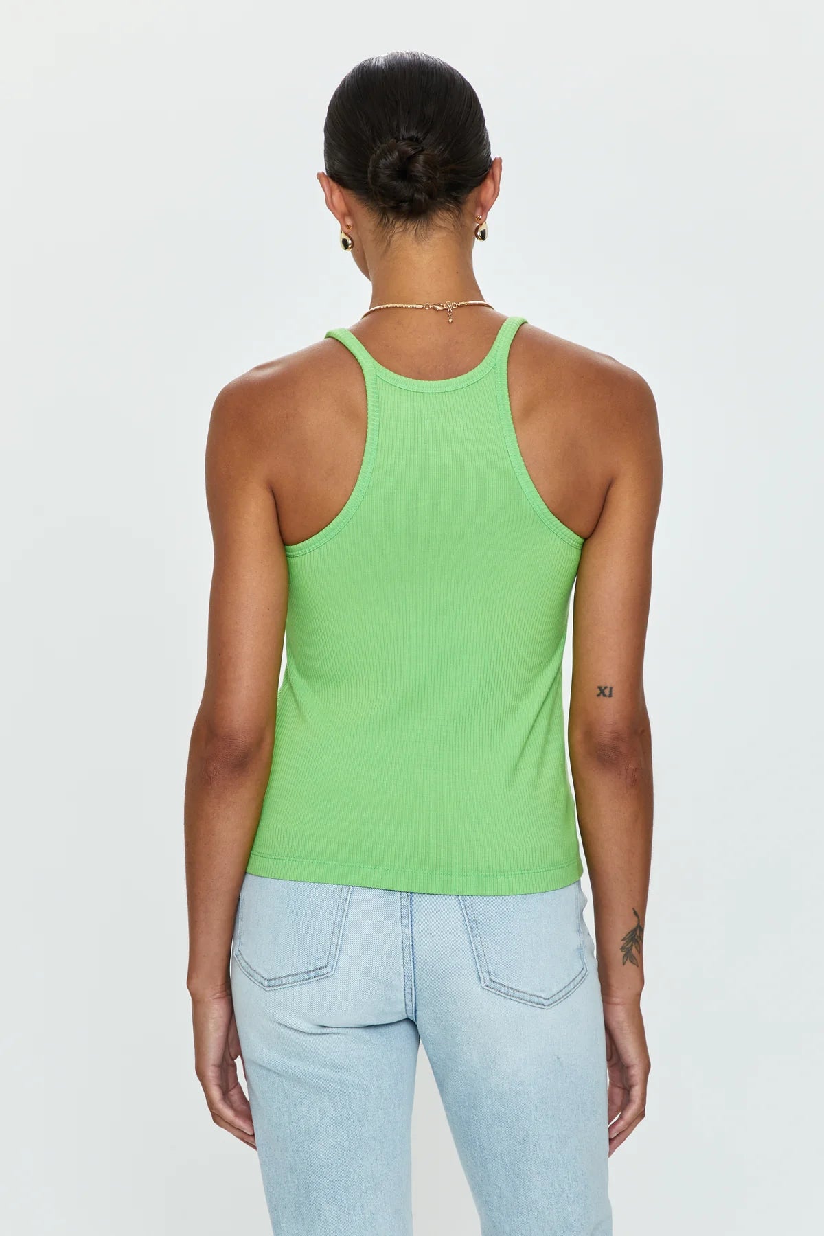 A pop of color styling hero, Paloma is a classic everyday tank with elevated design notes and expert construction for endless wearability. Ribbed binding at neckline and arm holes.