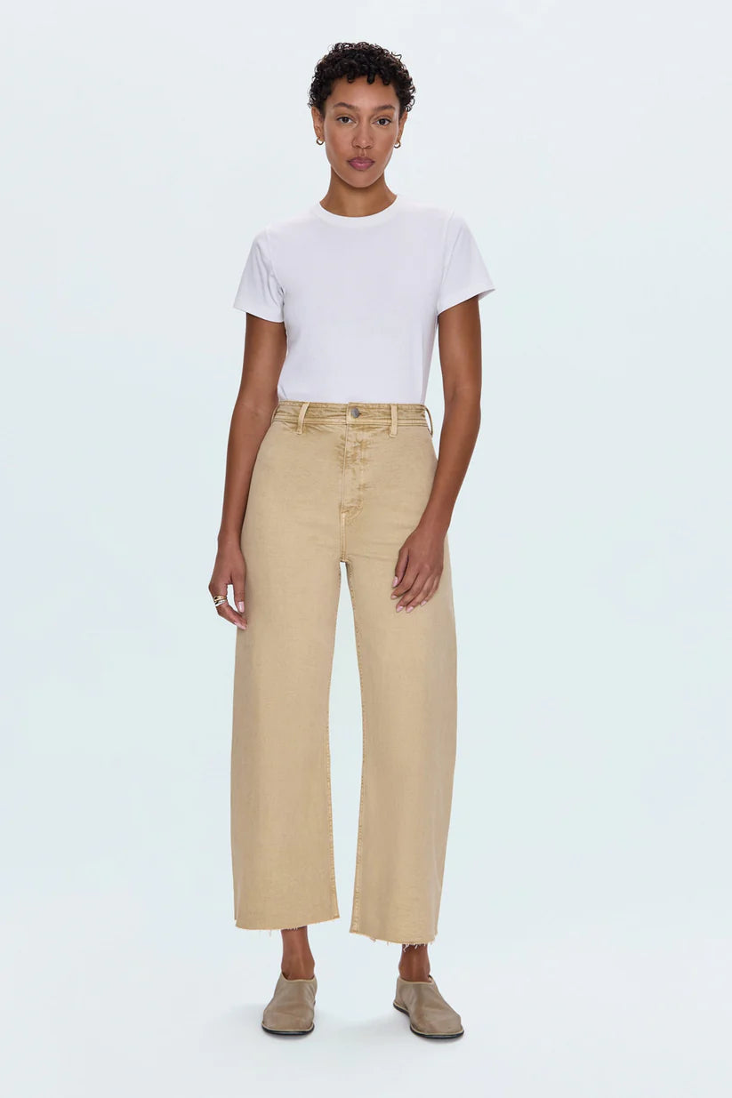 Meet the Penny Crop in Sand Dollar, designed to be your new everyday essential. These jeans feature a high-rise waist that flatters and defines, flowing into a chic wide-leg silhouette. The cropped, ankle-length hemline is perfect for showcasing your favorite footwear. Crafted from our signature comfort stretch denim, they offer unparalleled flexibility and a perfect fit that moves with you. Thoughtful details like a double-stitched waistline and modern scissor-cut hems add a touch of refined edge. 
