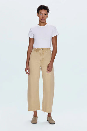 Meet the Penny Crop in Sand Dollar, designed to be your new everyday essential. These jeans feature a high-rise waist that flatters and defines, flowing into a chic wide-leg silhouette. The cropped, ankle-length hemline is perfect for showcasing your favorite footwear. Crafted from our signature comfort stretch denim, they offer unparalleled flexibility and a perfect fit that moves with you. Thoughtful details like a double-stitched waistline and modern scissor-cut hems add a touch of refined edge. 