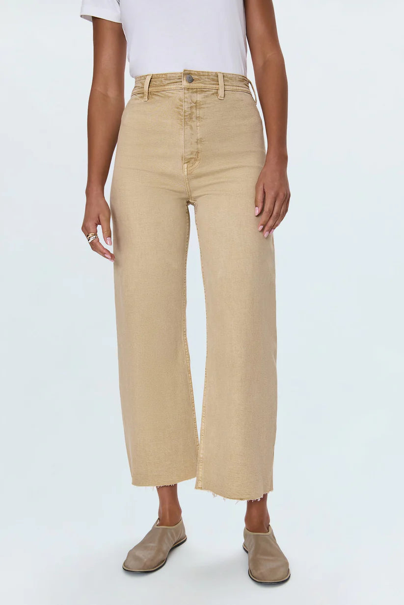 Meet the Penny Crop in Sand Dollar, designed to be your new everyday essential. These jeans feature a high-rise waist that flatters and defines, flowing into a chic wide-leg silhouette. The cropped, ankle-length hemline is perfect for showcasing your favorite footwear. Crafted from our signature comfort stretch denim, they offer unparalleled flexibility and a perfect fit that moves with you. Thoughtful details like a double-stitched waistline and modern scissor-cut hems add a touch of refined edge. 