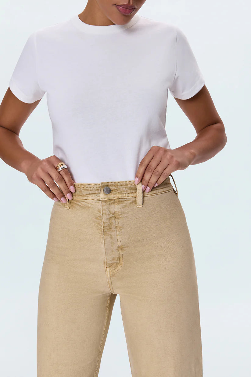 Meet the Penny Crop in Sand Dollar, designed to be your new everyday essential. These jeans feature a high-rise waist that flatters and defines, flowing into a chic wide-leg silhouette. The cropped, ankle-length hemline is perfect for showcasing your favorite footwear. Crafted from our signature comfort stretch denim, they offer unparalleled flexibility and a perfect fit that moves with you. Thoughtful details like a double-stitched waistline and modern scissor-cut hems add a touch of refined edge. 