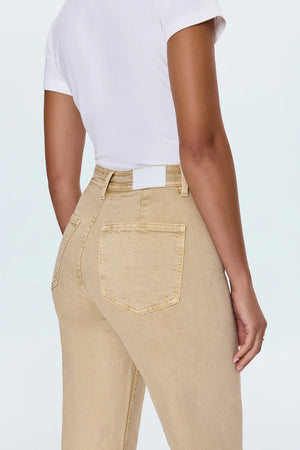 Meet the Penny Crop in Sand Dollar, designed to be your new everyday essential. These jeans feature a high-rise waist that flatters and defines, flowing into a chic wide-leg silhouette. The cropped, ankle-length hemline is perfect for showcasing your favorite footwear. Crafted from our signature comfort stretch denim, they offer unparalleled flexibility and a perfect fit that moves with you. Thoughtful details like a double-stitched waistline and modern scissor-cut hems add a touch of refined edge. 