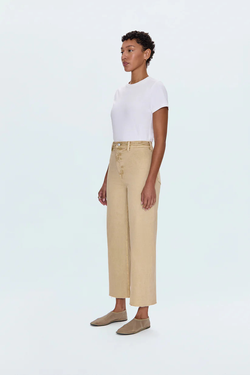 Meet the Penny Crop in Sand Dollar, designed to be your new everyday essential. These jeans feature a high-rise waist that flatters and defines, flowing into a chic wide-leg silhouette. The cropped, ankle-length hemline is perfect for showcasing your favorite footwear. Crafted from our signature comfort stretch denim, they offer unparalleled flexibility and a perfect fit that moves with you. Thoughtful details like a double-stitched waistline and modern scissor-cut hems add a touch of refined edge. 
