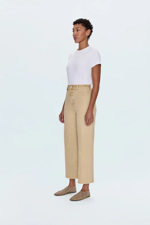 Meet the Penny Crop in Sand Dollar, designed to be your new everyday essential. These jeans feature a high-rise waist that flatters and defines, flowing into a chic wide-leg silhouette. The cropped, ankle-length hemline is perfect for showcasing your favorite footwear. Crafted from our signature comfort stretch denim, they offer unparalleled flexibility and a perfect fit that moves with you. Thoughtful details like a double-stitched waistline and modern scissor-cut hems add a touch of refined edge. 