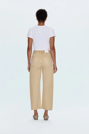 Meet the Penny Crop in Sand Dollar, designed to be your new everyday essential. These jeans feature a high-rise waist that flatters and defines, flowing into a chic wide-leg silhouette. The cropped, ankle-length hemline is perfect for showcasing your favorite footwear. Crafted from our signature comfort stretch denim, they offer unparalleled flexibility and a perfect fit that moves with you. Thoughtful details like a double-stitched waistline and modern scissor-cut hems add a touch of refined edge. 