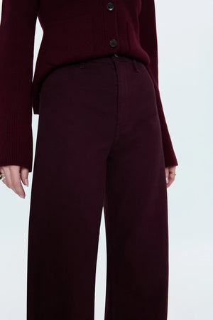 Maroon cardigan and pants on a white background