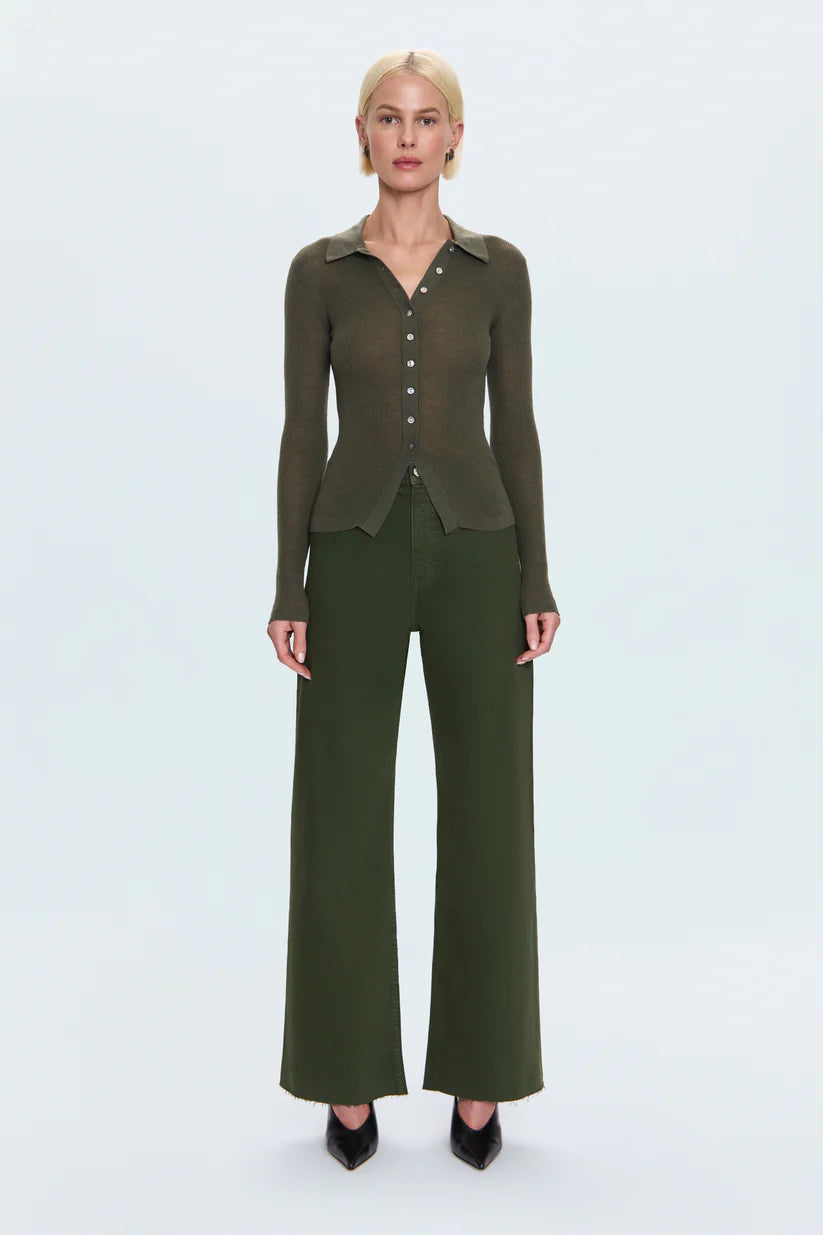 Woman wearing a green outfit on a white background