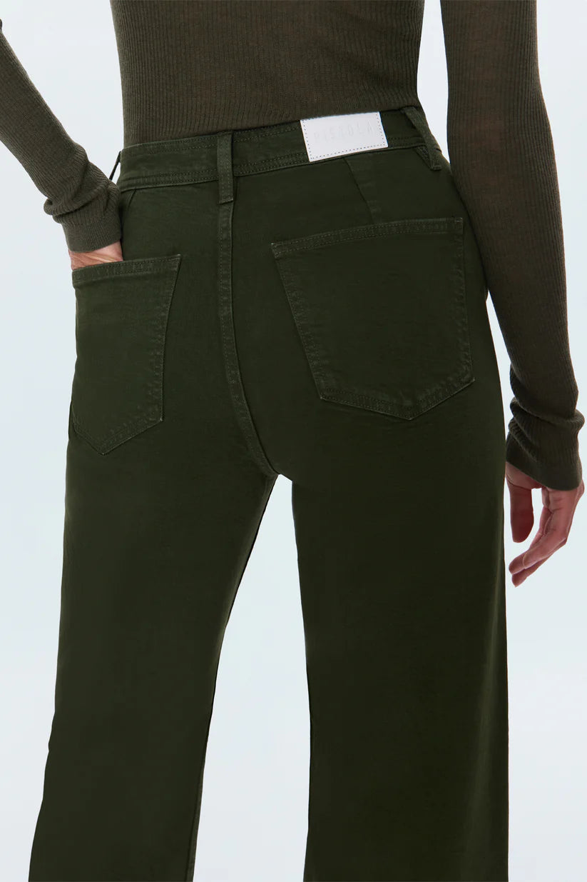 Person wearing dark green pants on a white background
