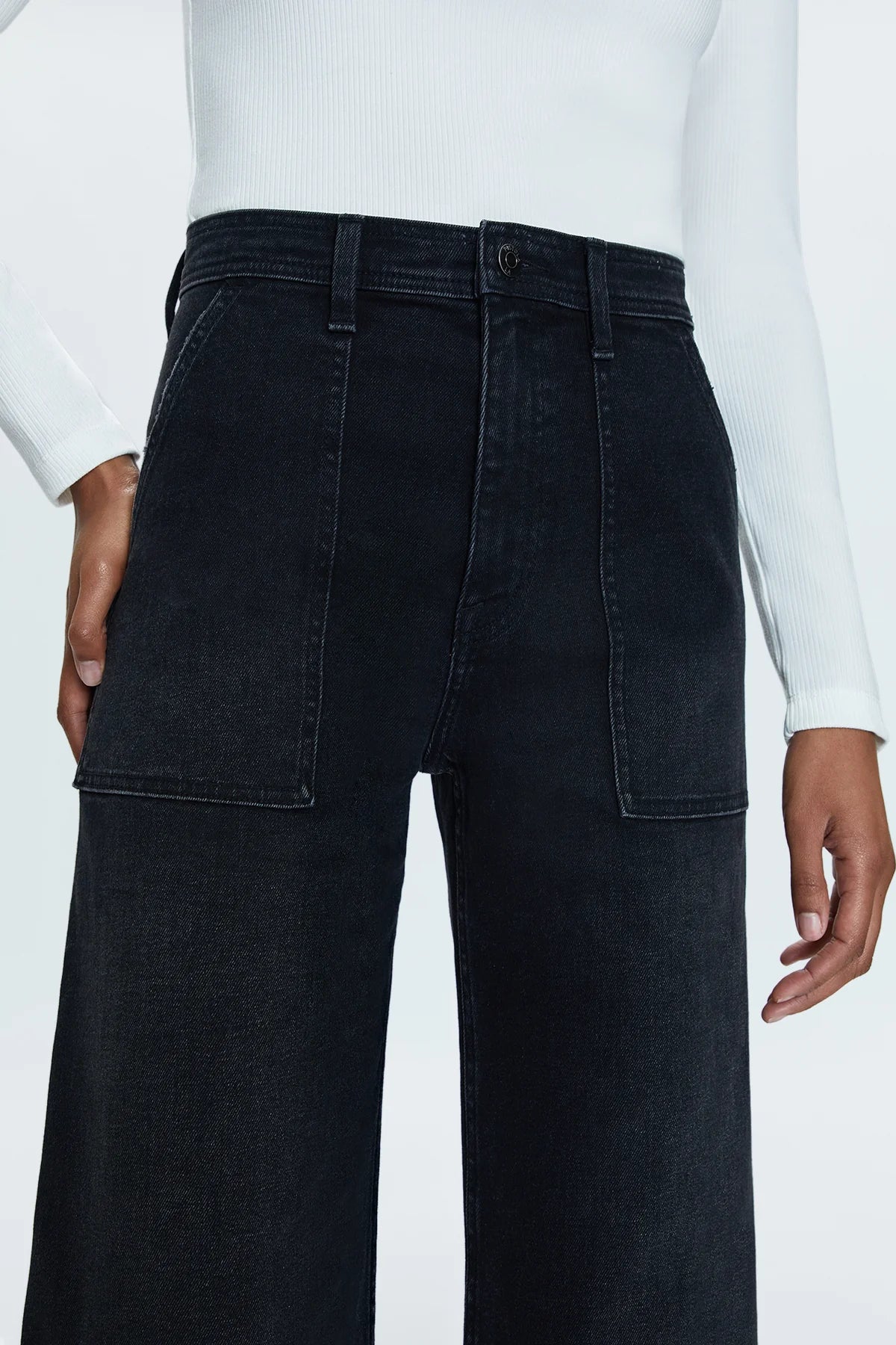 High rise waist, with a wide leg silhouette, front patch pockets and a full length hemline. Crafted from our signature comfort stretch denim, Collins is a washed black denim with utility style patch pockets.