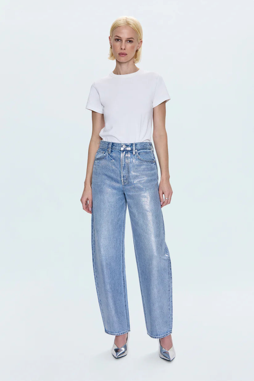 Woman wearing a white t-shirt and light blue jeans on a white background