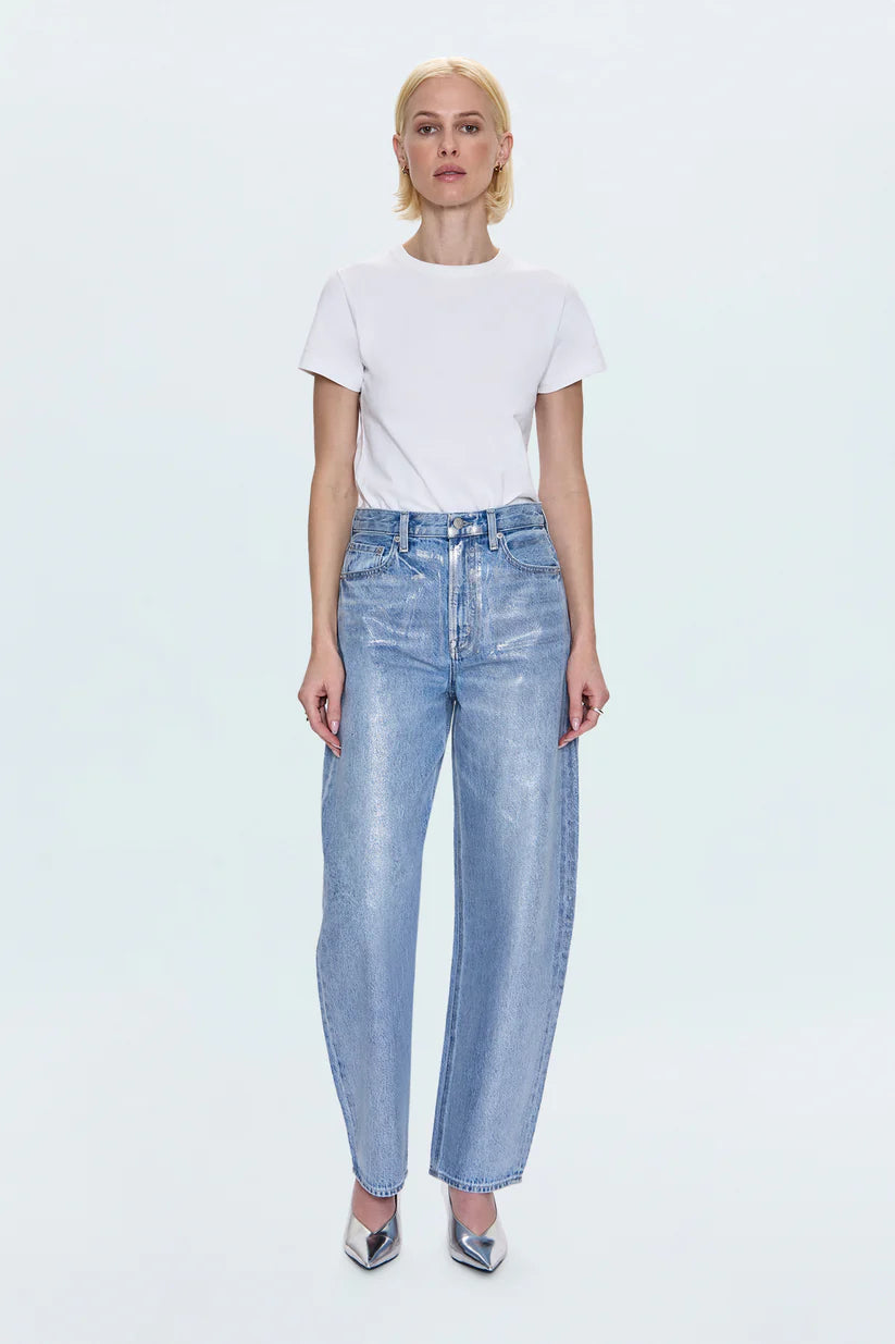 Person wearing a white t-shirt and light blue jeans on a white background