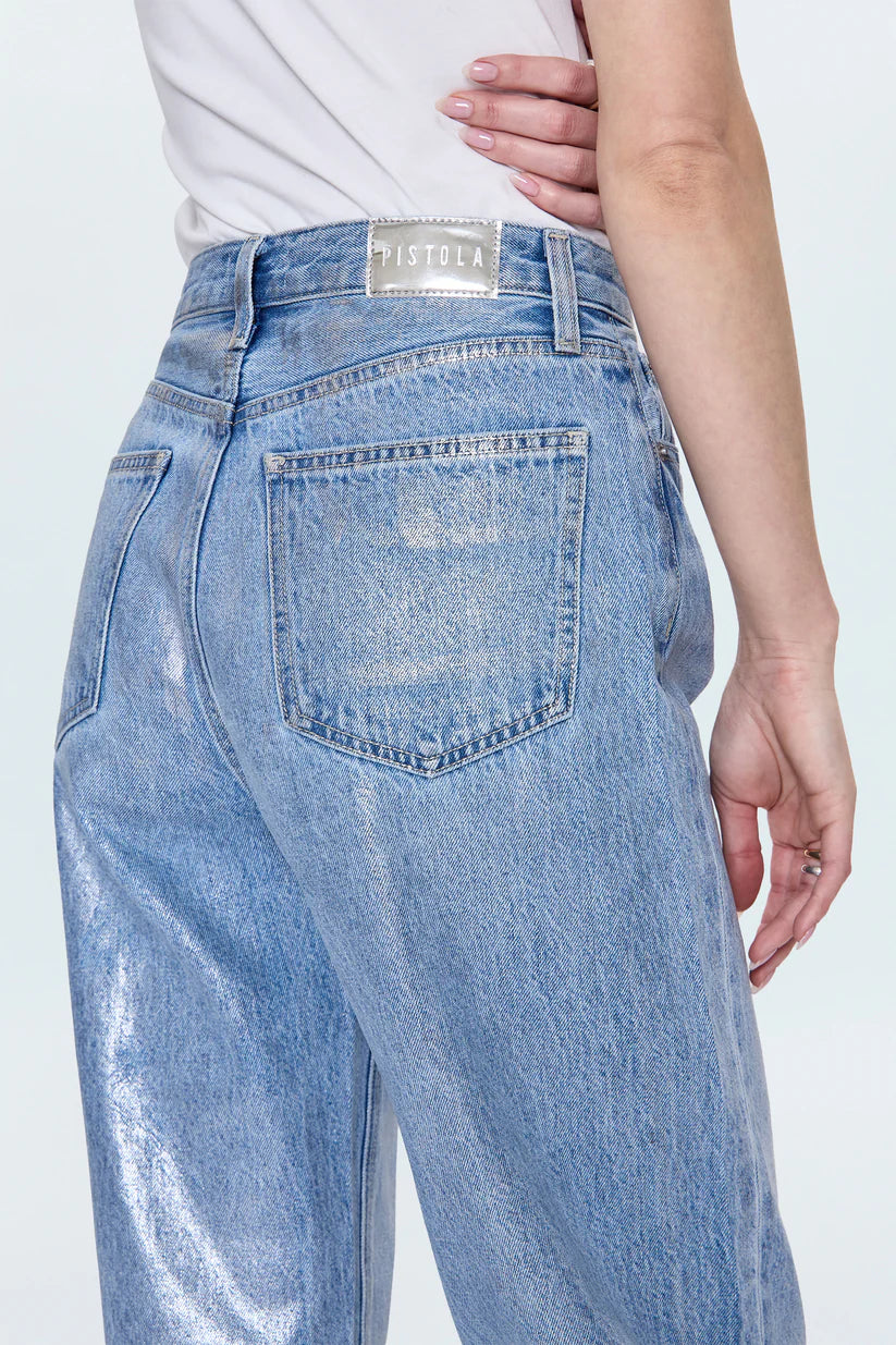 Light blue jeans with a brand label on a white background