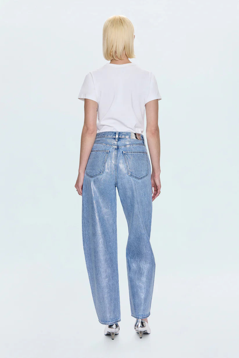 Person wearing light blue jeans and a white t-shirt on a white background