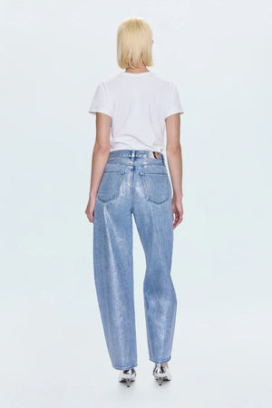 Person wearing light blue jeans and a white t-shirt on a white background
