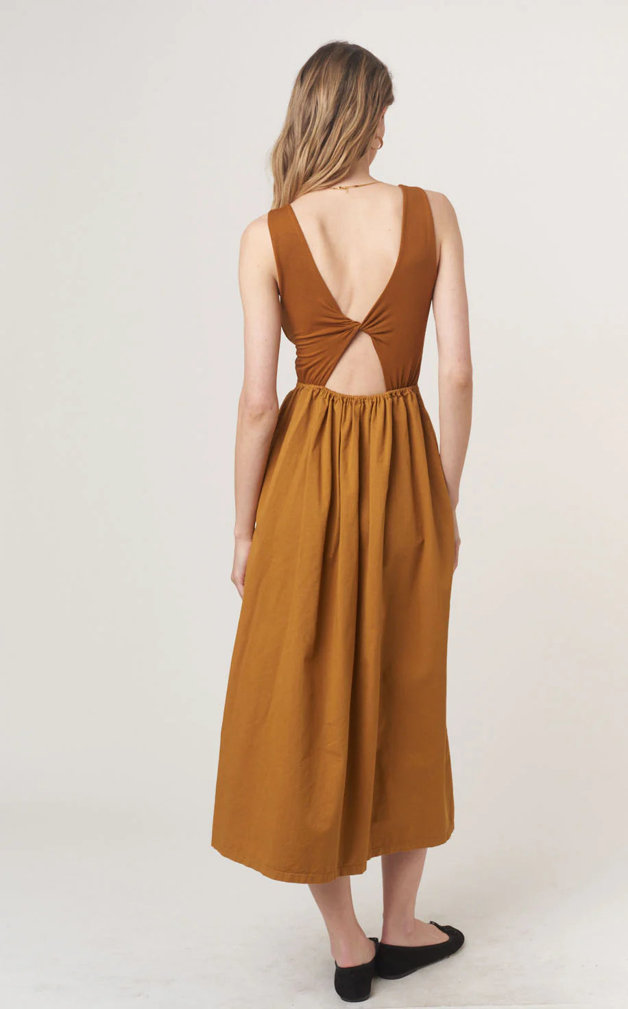 The Corinne Mixed Fabric Tank Dress combines some of our favorite, feminine trends this season. The volume skirt is accentuated at the waist and hits at your ankle, while the top portion is fitted with a scoop neckline and comfortable rib fabric. Of course, we had to add one last fun pop, and you're sure to love the twist detail in the back. Ready to strut off into the sunset with Corinne?