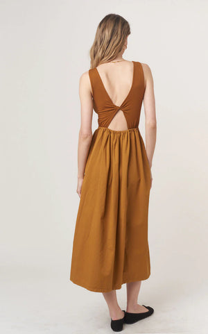The Corinne Mixed Fabric Tank Dress combines some of our favorite, feminine trends this season. The volume skirt is accentuated at the waist and hits at your ankle, while the top portion is fitted with a scoop neckline and comfortable rib fabric. Of course, we had to add one last fun pop, and you're sure to love the twist detail in the back. Ready to strut off into the sunset with Corinne?