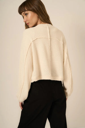 The First Dibs Chenille Cardi is all about keeping it cozy without sacrificing style. Made from a super soft chenille sweater fabric, this relaxed-fit cardi features drop shoulders and a cropped silhouette that elevates any outfit. It’s the perfect piece to throw on over your favorite tops or dresses, so get ready to make layering your new love language.