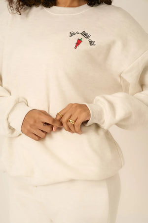 The I'm A Little Chili Sweatshirt features the cutest chili graphic on the chest that adds just the right amount of heat. This sweatshirt features our ultra-soft fleece with a relaxed fit, crew neckline, drop shoulders, and an embroidery screenprint combo on the chest. Pair with your favorite pair of joggers or a high-waisted jean for a comfortable and cute vibe.