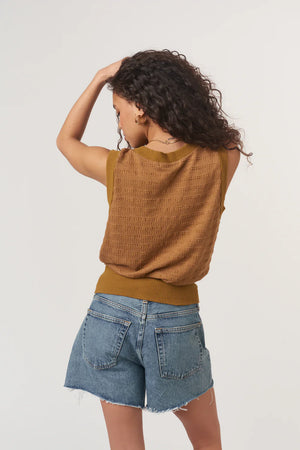 Ingrid Button Front Textured Tank is made from a striped sweater rib with a detailed structure. Designed with a V neckline, front buttons, and a banded hemline for a more tailored fit, it’s an elevated take on a closet essential.