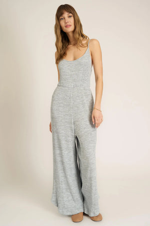 A jumpsuit this good makes us want to dance.  Our Last Dance Twist Back Sweater Rib Jumpsuit is sure to be a best seller. It features a scoop neckline, spaghetti straps, twist-back detail, and a flattering silhouette thanks to the elastic waist. Our sweater rib fabric is a fan favorite, and this time, it gets an all new marled look. Pair with sneakers for a look you'll feel comfortable in all day long.