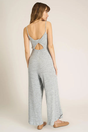 A jumpsuit this good makes us want to dance.  Our Last Dance Twist Back Sweater Rib Jumpsuit is sure to be a best seller. It features a scoop neckline, spaghetti straps, twist-back detail, and a flattering silhouette thanks to the elastic waist. Our sweater rib fabric is a fan favorite, and this time, it gets an all new marled look. Pair with sneakers for a look you'll feel comfortable in all day long.