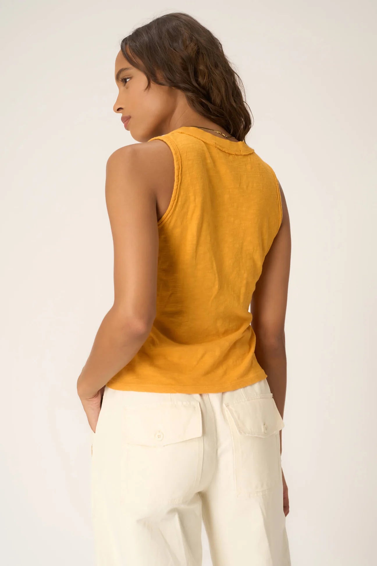 The Let Me Know Relaxed Slub V Neck Tank is a staple for mastering the casual but cute look. With a slub 100% cotton fabric, flattering v-neckline, contrast rib edging, and relaxed fit, you'll find that this one is easy to style without much thought. Tuck into some trendy jeans and a fun belt for a playful spring daytime look.