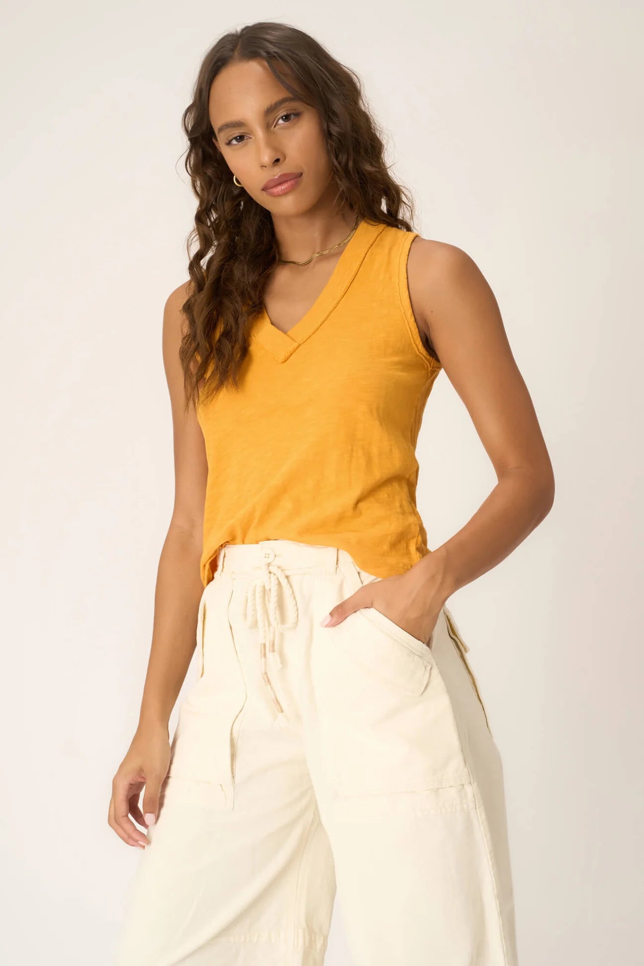 The Let Me Know Relaxed Slub V Neck Tank is a staple for mastering the casual but cute look. With a slub 100% cotton fabric, flattering v-neckline, contrast rib edging, and relaxed fit, you'll find that this one is easy to style without much thought. Tuck into some trendy jeans and a fun belt for a playful spring daytime look.