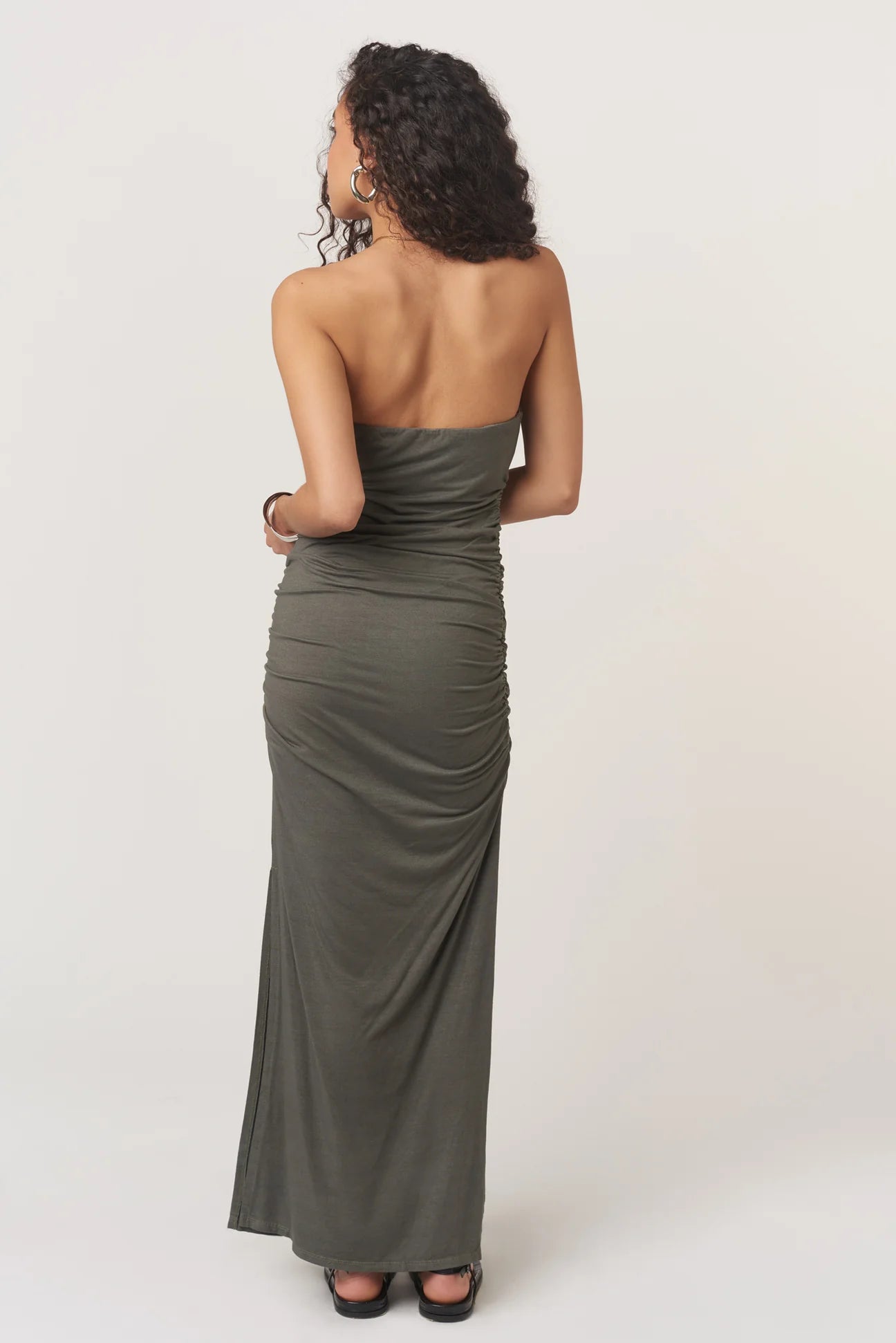 The Nala Strapless Side Ruched Dress is a need, not a want. The strapless neckline and fitted silhouette are made extra flattering thanks to the side ruching details. The maxi length keeps it on-trend, and the side slit keeps it flirty.