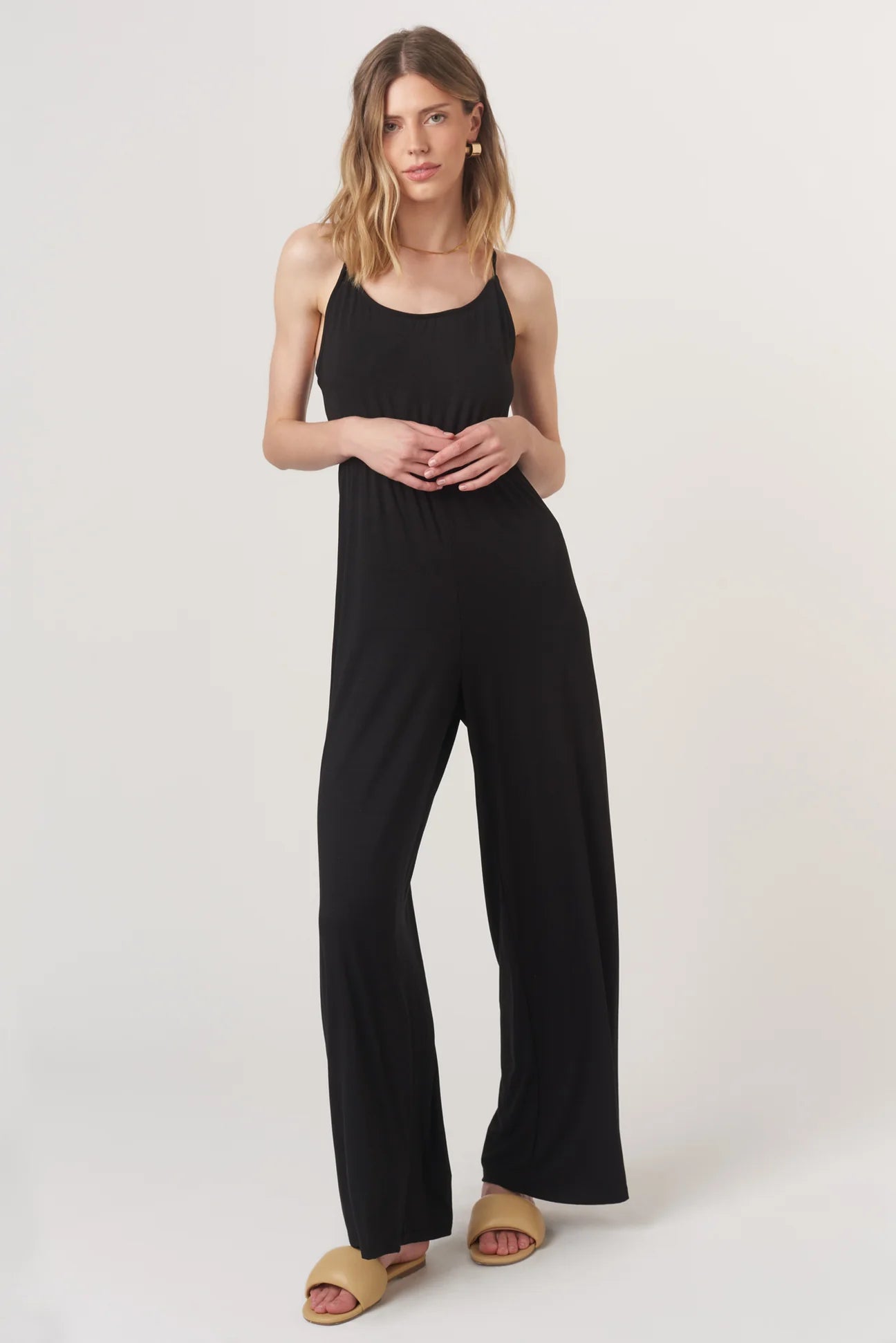The Night Moves Tie Back Jumpsuit brings effortless chic to any occasion. With a relaxed, flattering fit and a bold strappy back detail, this jumpsuit seamlessly transitions from daytime ease to evening elegance.