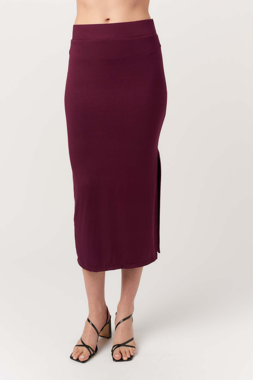 Purple pencil skirt worn by a person on a white background
