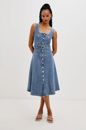 The Aliso denim midi dress features a flared skirt with plenty of movement, crafted from recycled cotton. An adjustable denim belt allows for a personalized, form-flattering fit.