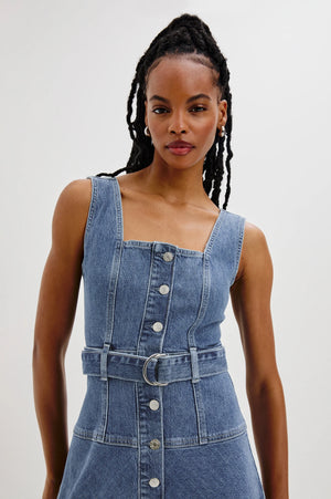 The Aliso denim midi dress features a flared skirt with plenty of movement, crafted from recycled cotton. An adjustable denim belt allows for a personalized, form-flattering fit.