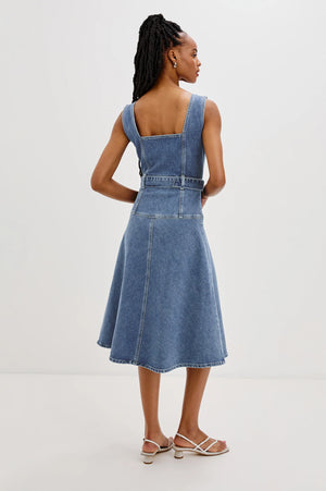 The Aliso denim midi dress features a flared skirt with plenty of movement, crafted from recycled cotton. An adjustable denim belt allows for a personalized, form-flattering fit.
